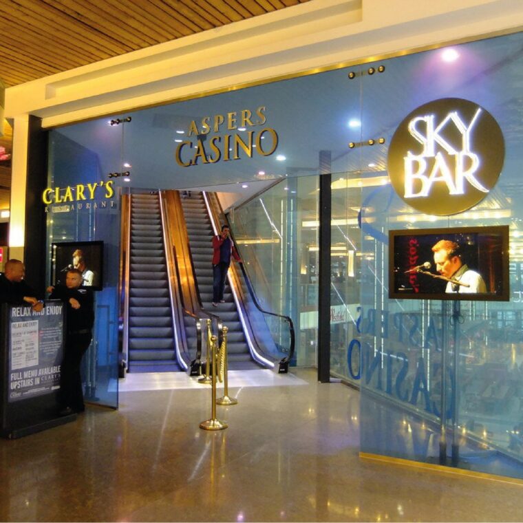 Casinos - Foyer with a security desk and escalators up the the casino