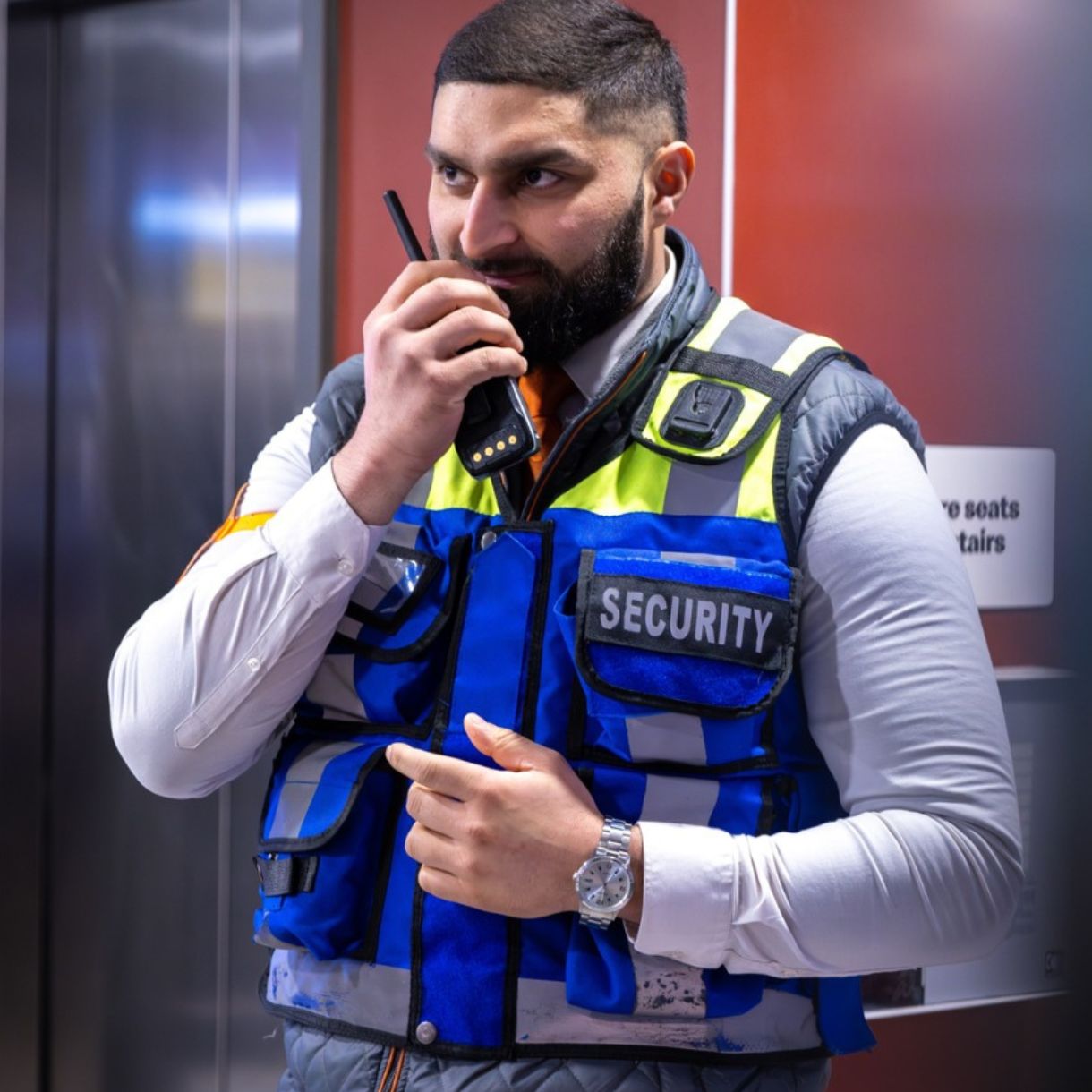 Security staff talking into radio