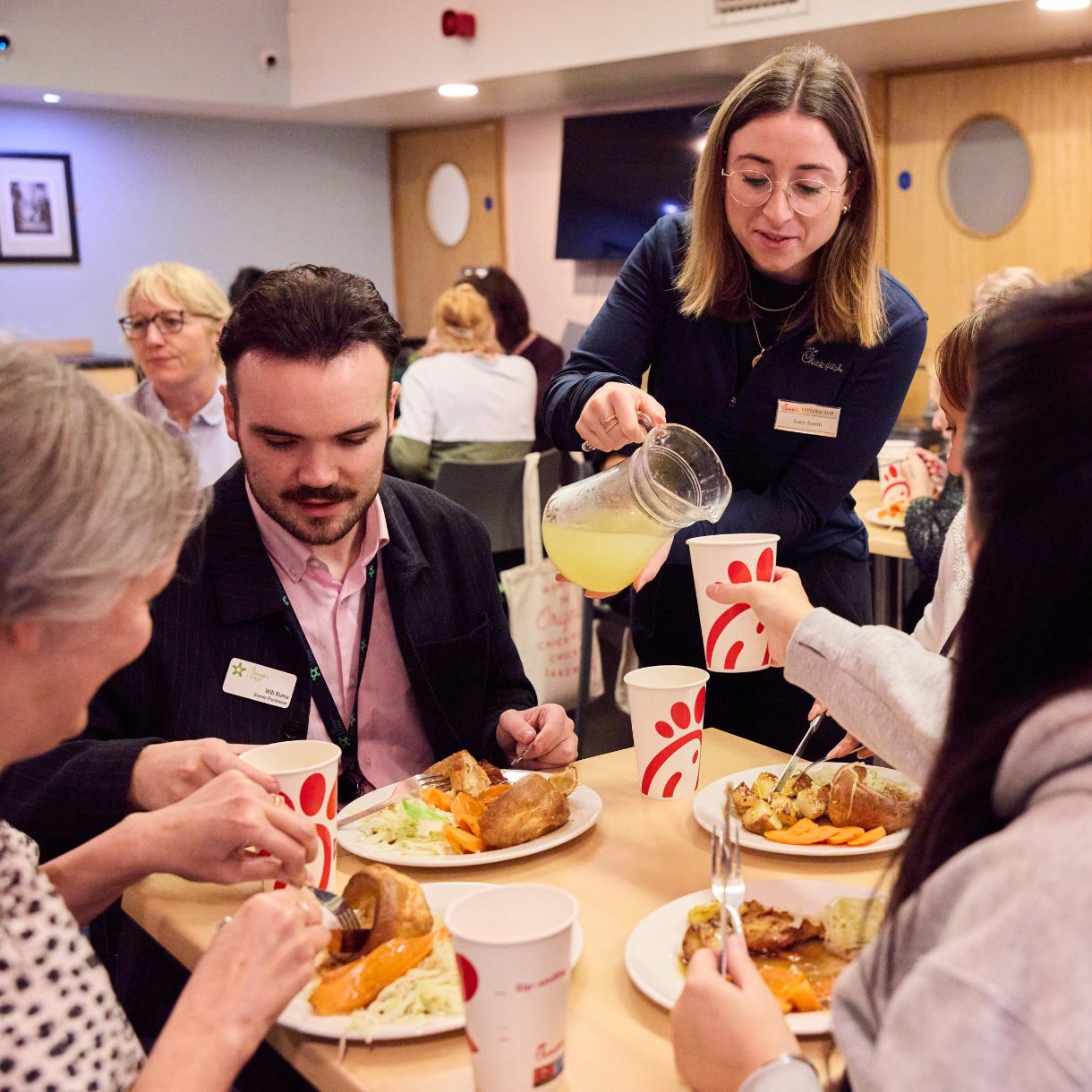 Chick-fil-A Leeds team partnering with St George’s Crypt to donate surplus food through the Shared Table® programme, supporting local homeless and vulnerable communities.